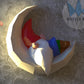 Gnome sleeping on moon