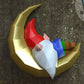 Gnome sleeping on moon