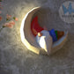 Gnome sleeping on moon