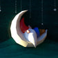 Gnome sleeping on moon